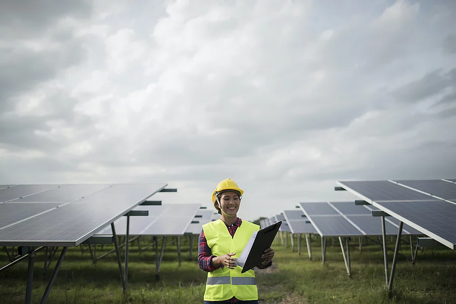 Engineer electric woman checking and maintenance of solar cells